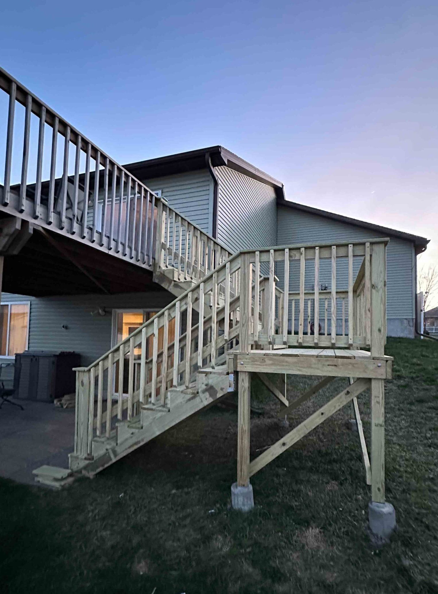Large, newly constructed composite deck with black railing