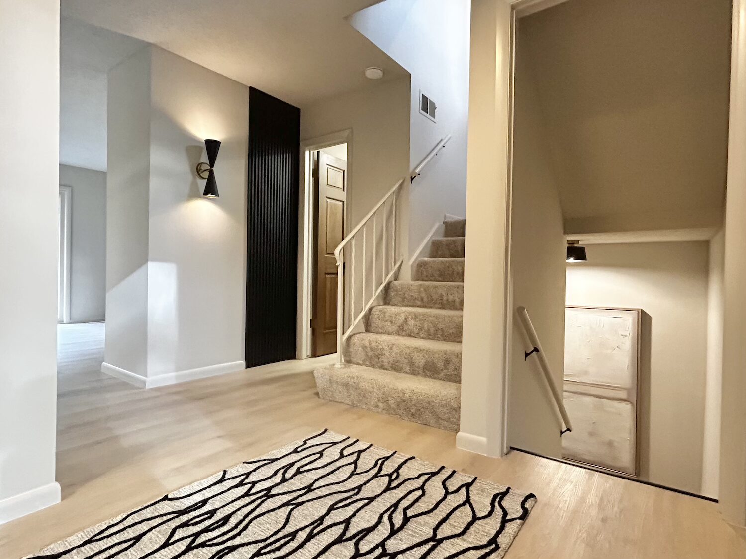 FullSizeRender-preview Beautiful grey and white remodeled kitchen with new dark black appliances.