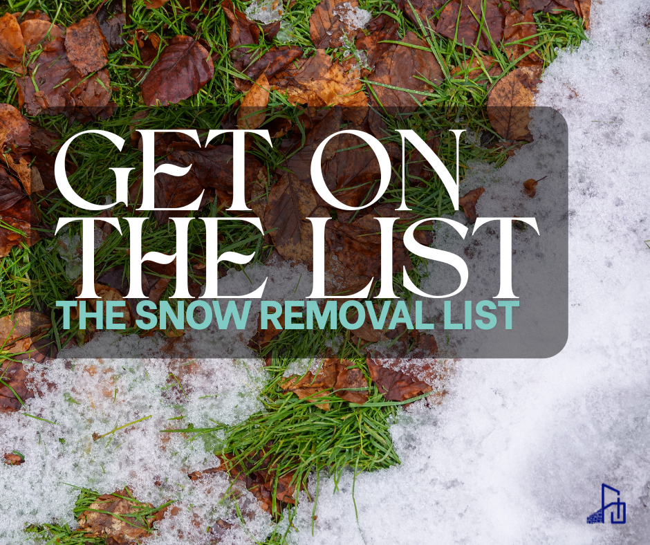 Large, wooden hexagon laid deck next to retaining wall.